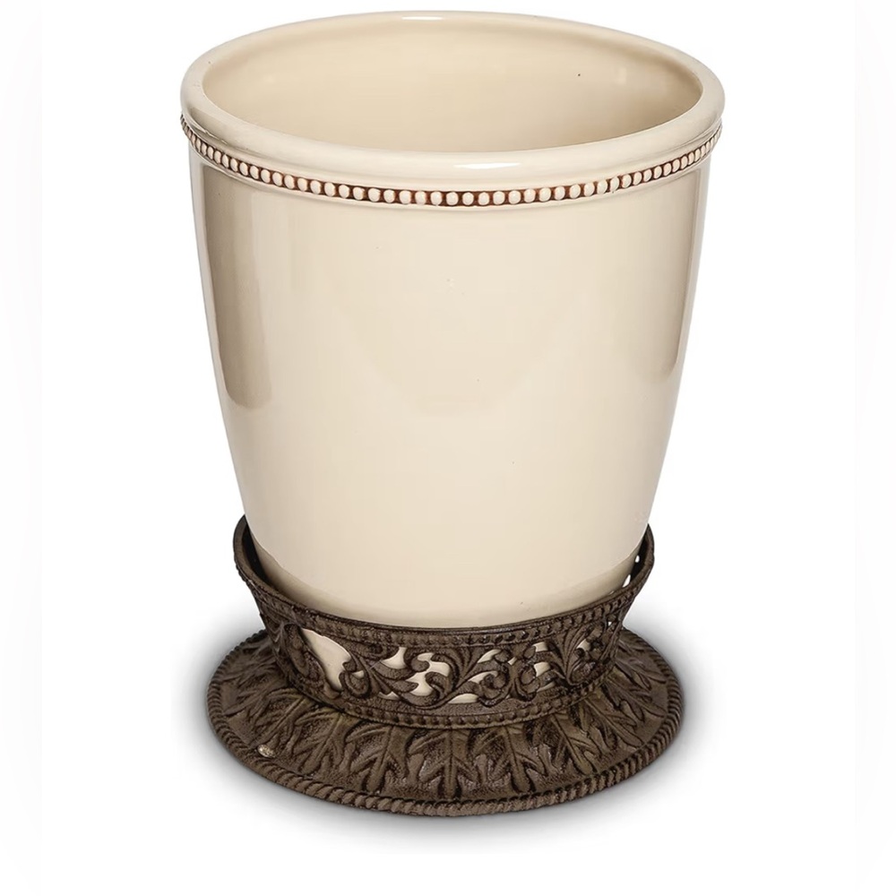 GG Collection Small Cream Ceramic Wastebasket with Acanthus Leaf Metal Base